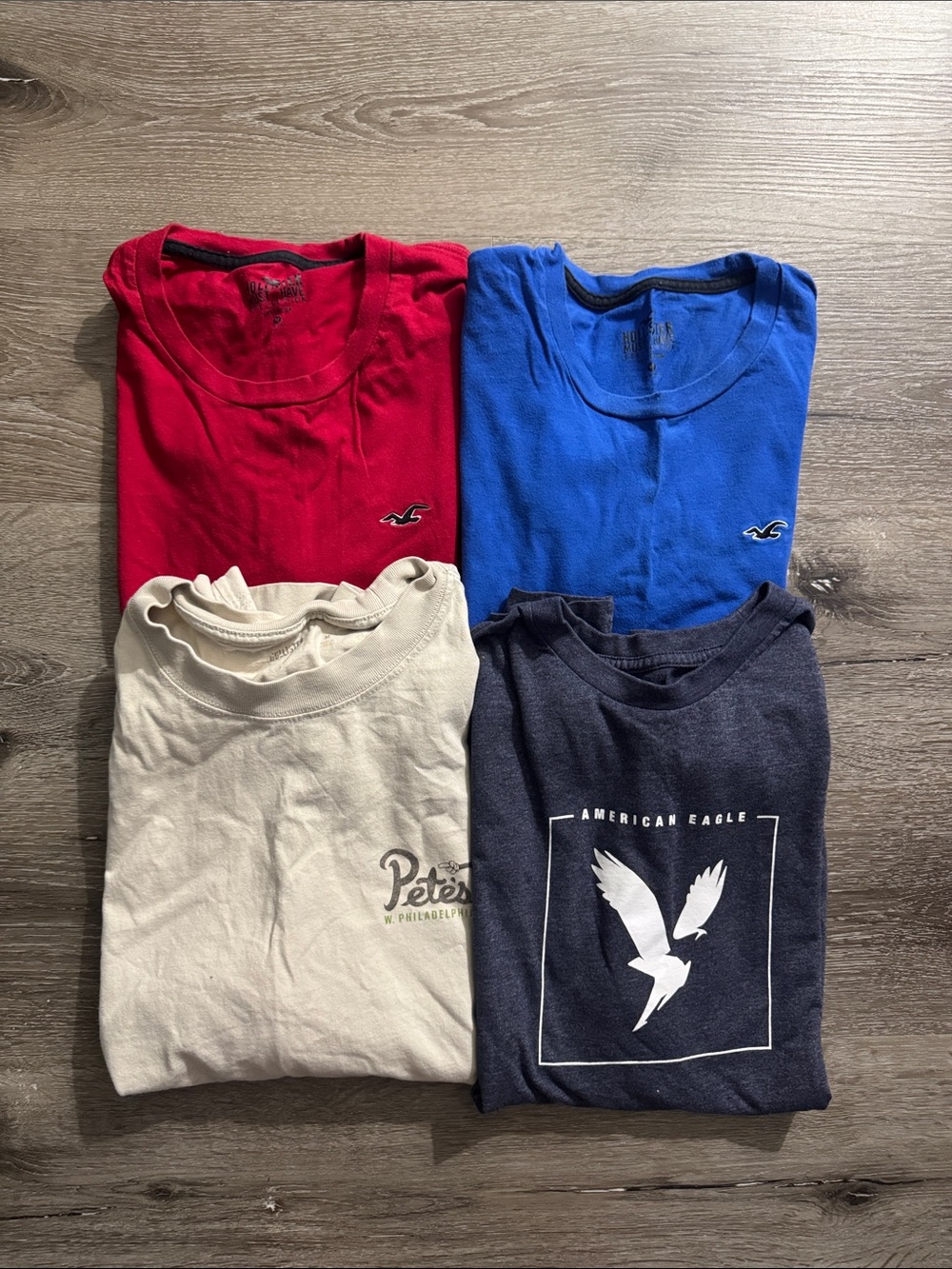 Four Hollister and American Eagle t-shirts.